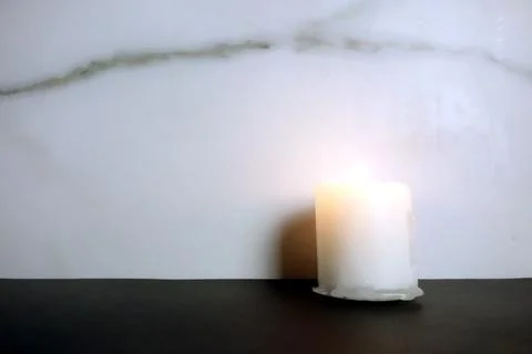 Candle burning on empty background Stock Photos