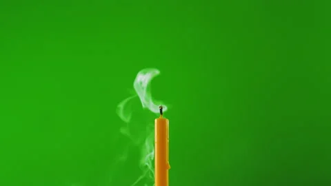 Candle burning fire flame on windy on green screen background of slow motion Stock Footage 219573683