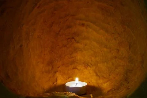 Candle burning inside a cleaned pumpkin, carved interior , abstract texture.. Foto stock