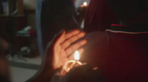 Candle burning inside hands Stock Footage 60690886