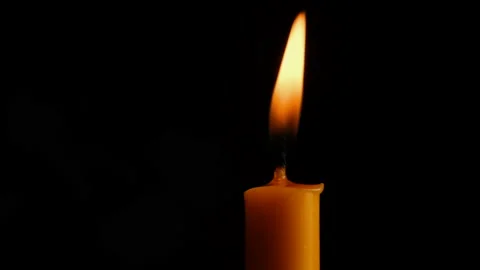 Candle burning isolated on dark background Stock Footage 147937886