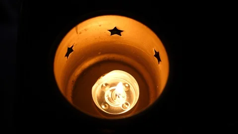 Candle burning light in darkness at Night. Round shape decor indoors. Top view. Stock Footage 128519105
