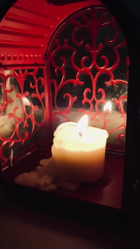 Candle burning in a red lamp Stock Footage 146897837