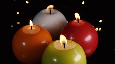 A candle is burning on the table and the flame is slowly moving in the wind Stock Footage 228400167