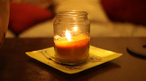 Candle Burning on Table with Rack Focus Video stock 32141062