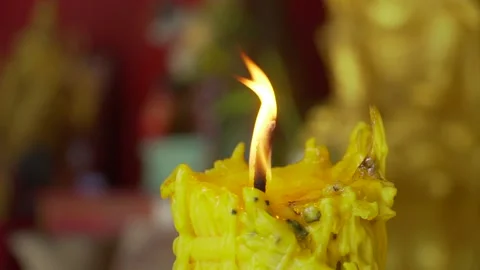 A candle burns in the Budi temple Stock Footage 222598367