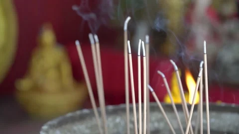 A candle burns in the Budi temple Stock Footage 224790171