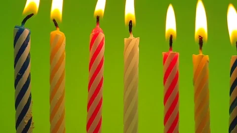 Candle burns on a colored background Video stock 117411831