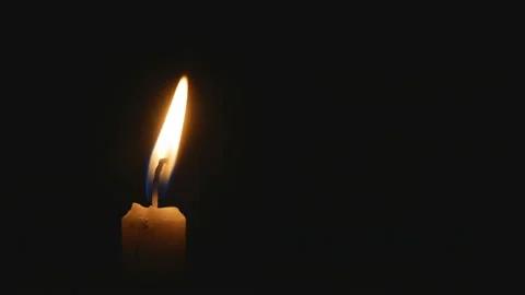 The candle burns in the dark Stock Footage 104375020