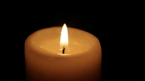 The candle burns in the dark isolated Video stock 102372956