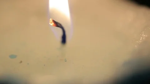 A candle burns in the darkroom Stock Footage 81592771
