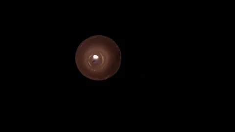 The candle burns, goes out and lights up again in the dark Stock Footage 252188658