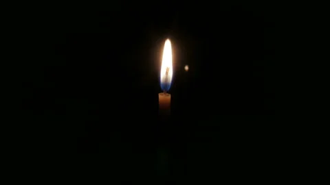 Candle burns quickly in timelapse on a black background Video stock 97957638