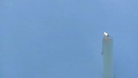 A candle burns in the snow 4 Video stock 327546668