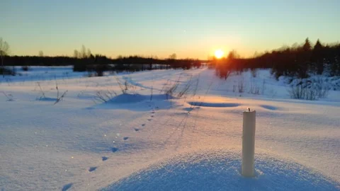 A candle burns at sunset Video stock 327930225