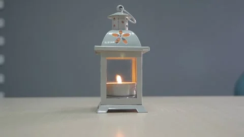 Candle burns in a white candlestick Stock Footage 163717468