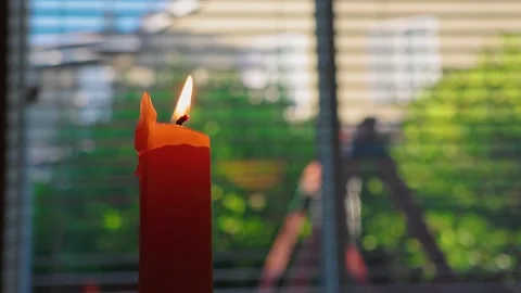 A Candle Burns by the Window Stock-Footage 317130082