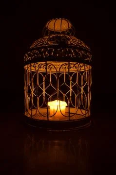 Candle in a cage Stockfoto's