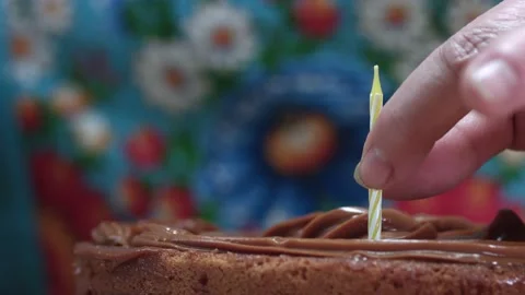 A candle in a cake Stock Footage 142930069