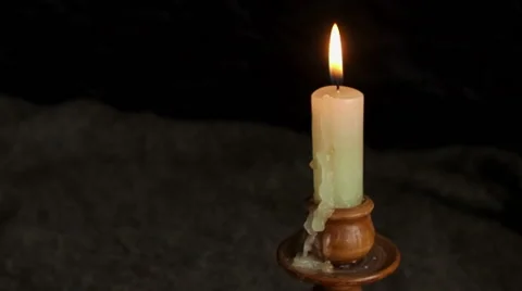 Candle in a candlestick burns Stock Footage 61168336