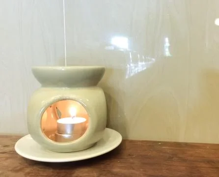 Candle in a container Stock Photos