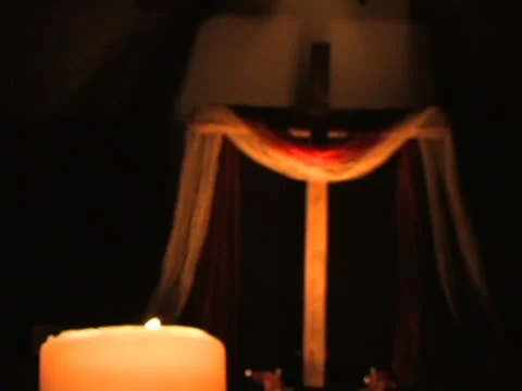 Candle with a Cross in the Background Stock Footage 9855551
