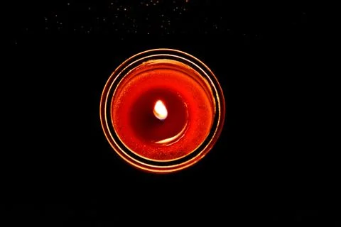 Candle in a dark background Stock Photos