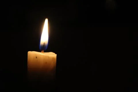 Candle in the dark background Stock Photos