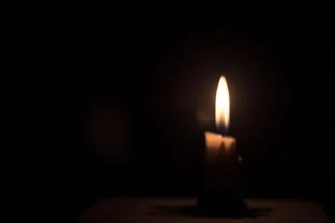 Candle in the dark background Stock Photos