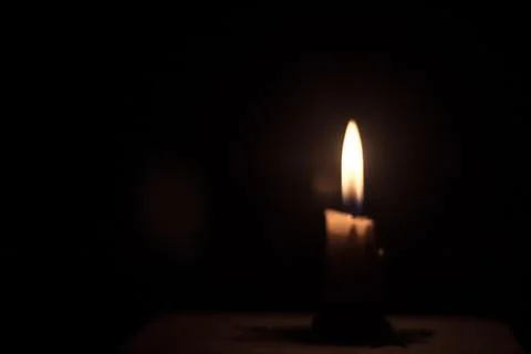 Candle in the dark background Stock Photos