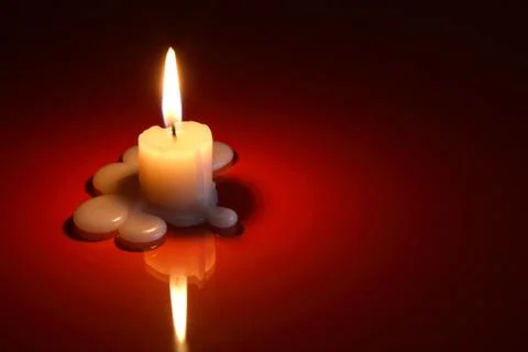Candle on dark Stock Photos