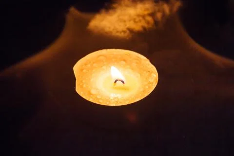 Candle in the dark Stock Photos