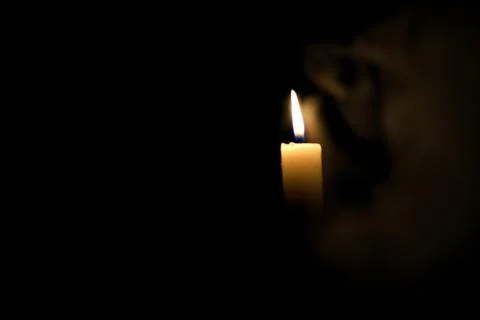 Candle in the dark. Stock Photos