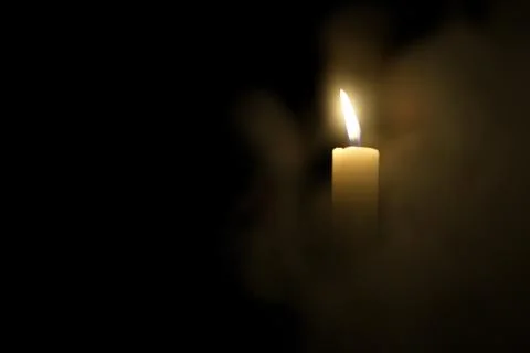 Candle in the dark. Stock Photos