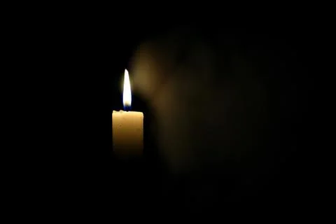 Candle in the dark Stock Photos