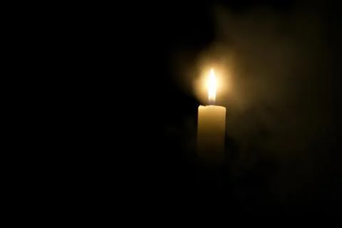 Candle in the dark. Stock Photos