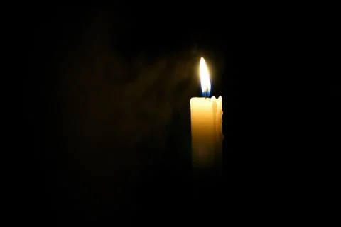 Candle in the dark. Stock Photos