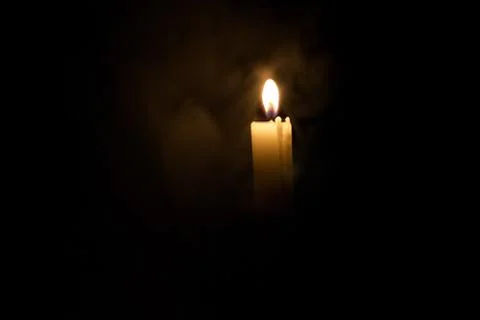 Candle in the dark. Stock Photos