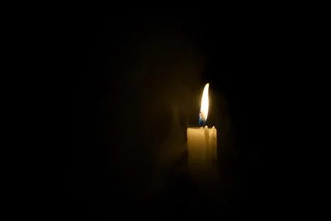 Candle in the dark. Stock Photos