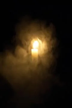 Candle in the dark. Stock Photos