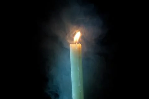 Candle in the dark Stock Photos