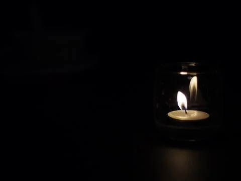 Candle in the dark Stock Photos