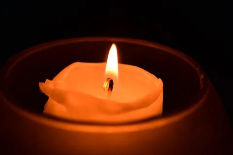 A candle in the dark Stock Photos