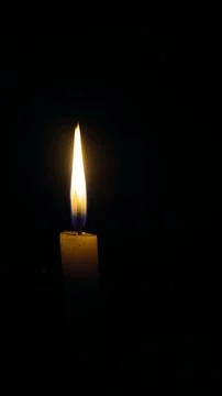Candle in dark Stock Photos