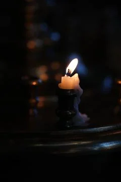 A candle in the dark Stock Photos