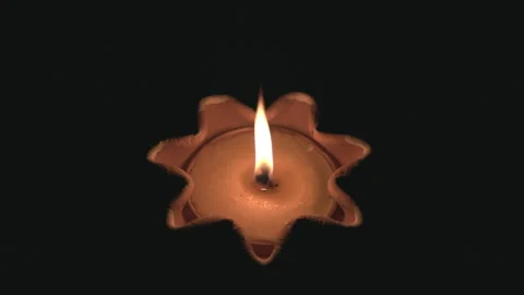 Candle in the dark, warm candlelight flame with smoke. Stock Footage 336999132