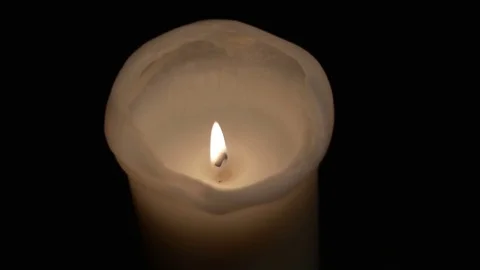Candle in the darkness being lit Stock Footage 82832086