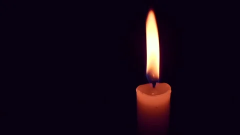 Candle in the darkness that does not want to go out Stock Footage 165474732