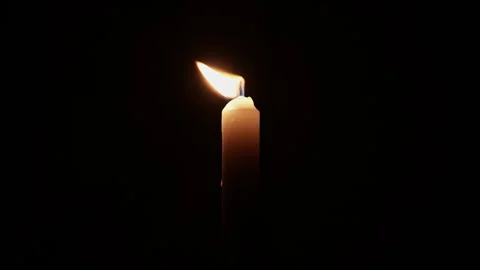 Candle in darkness. Single burning candle in dark room. Candle leaking hot .. Stock Footage 344625401
