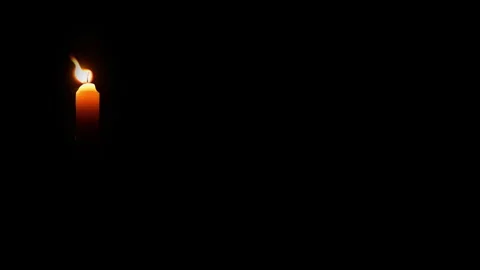 Candle in darkness. Single burning candle in dark room. Candle leaking hot .. Stock Footage 344625420
